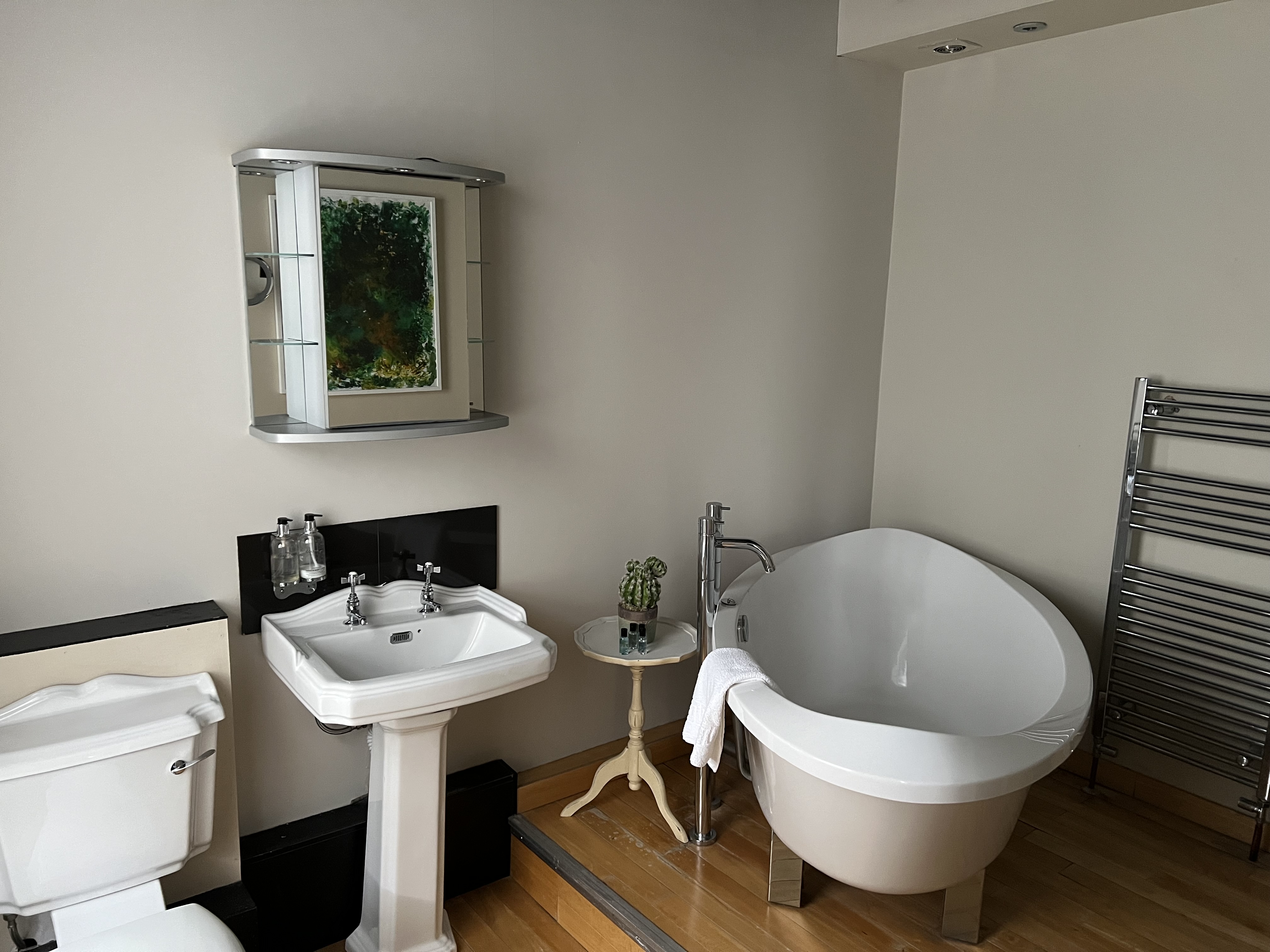 Modern ensuite bathroom with freestanding tub in one of The Silk House guest rooms
