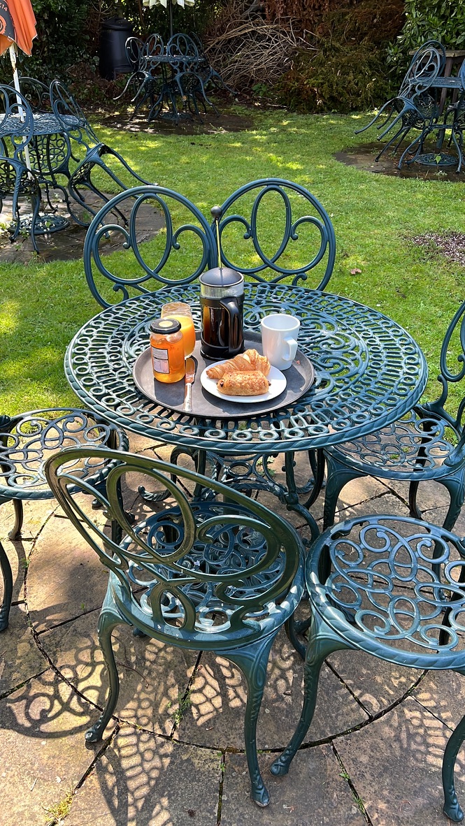 Breakfast pastries and coffee served in The Silk House garden