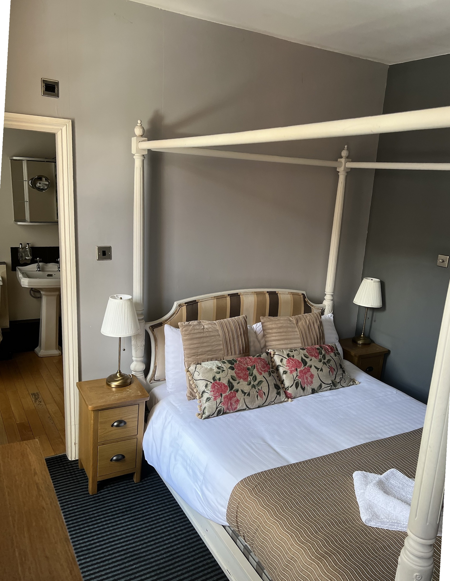 Four-poster bed in one of The Silk House's individually designed guest rooms
